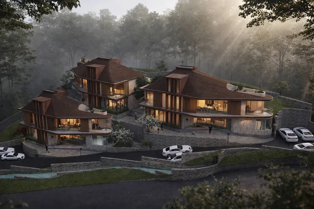 The three villas at dusk, lit from within, on a misty pine-forest hillside in Kasauli