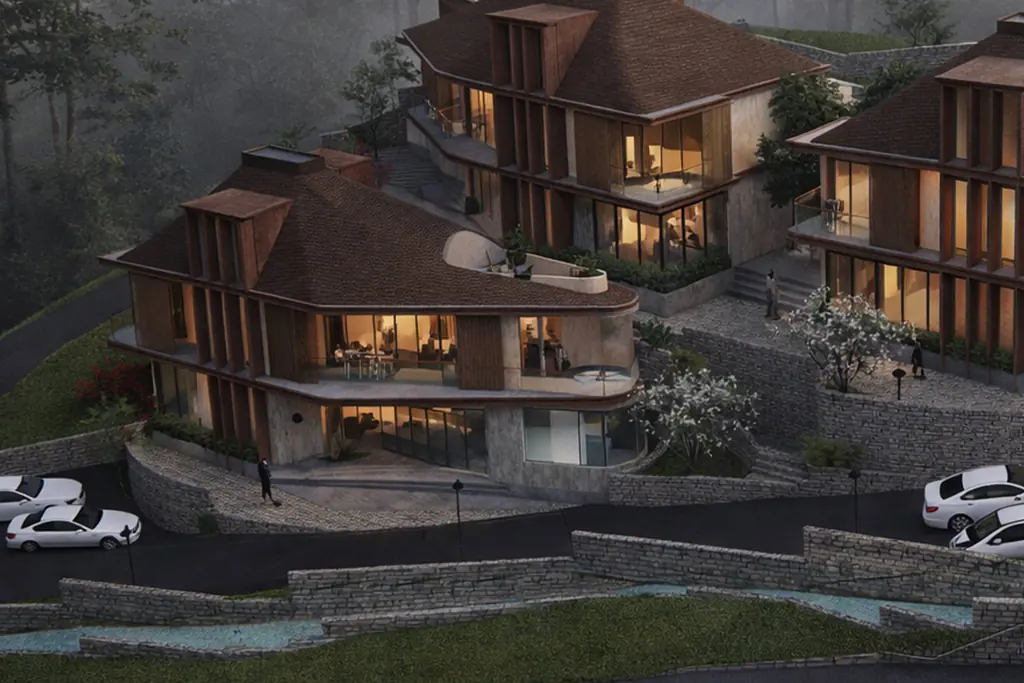 Villa Terrana on the garden terrace, its curved glass living room lit at dusk